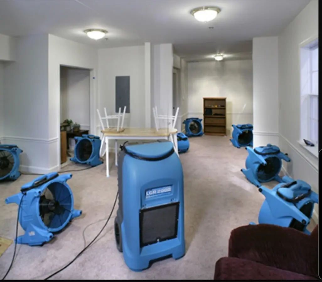 Air movers and dehumidifier setup for Water Damage Restoration in Smithville