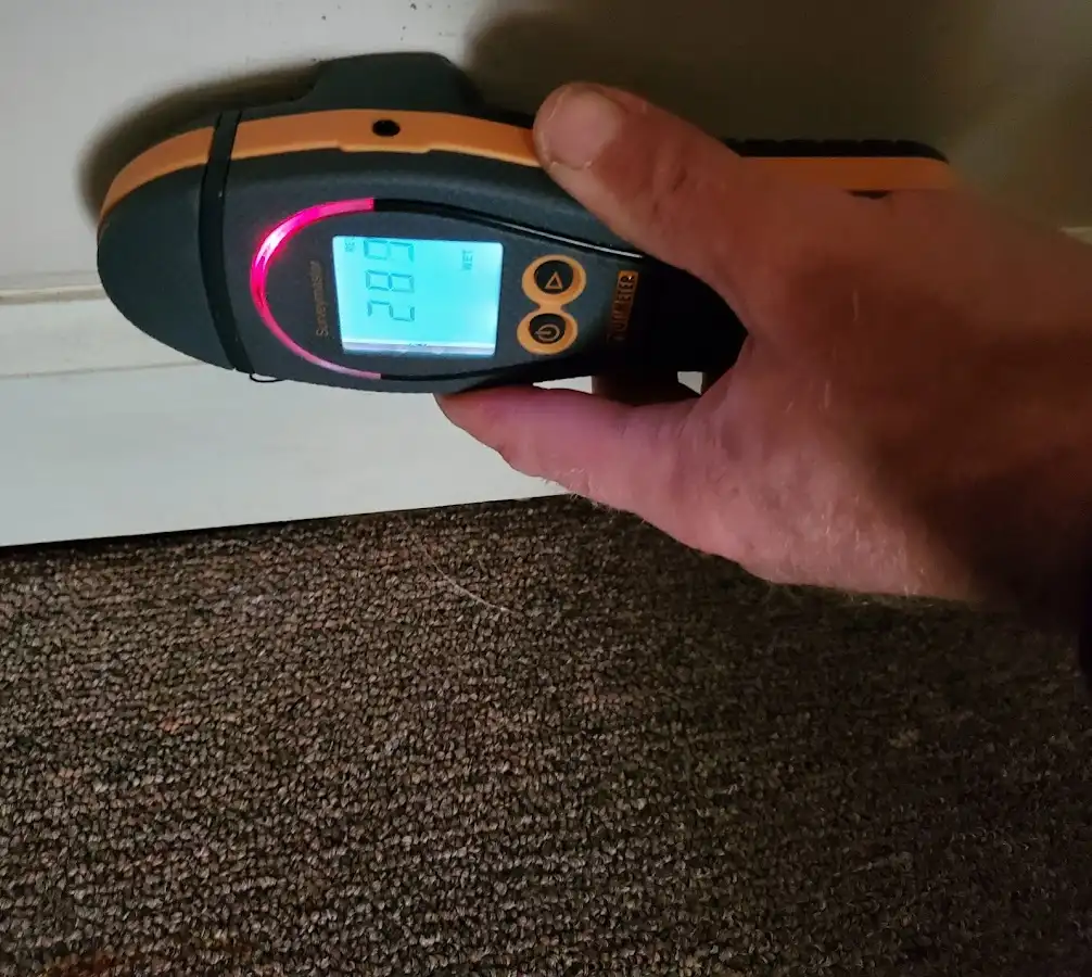 Moisture detection at baseboard during Burst Pipe Cleanup in Smithville